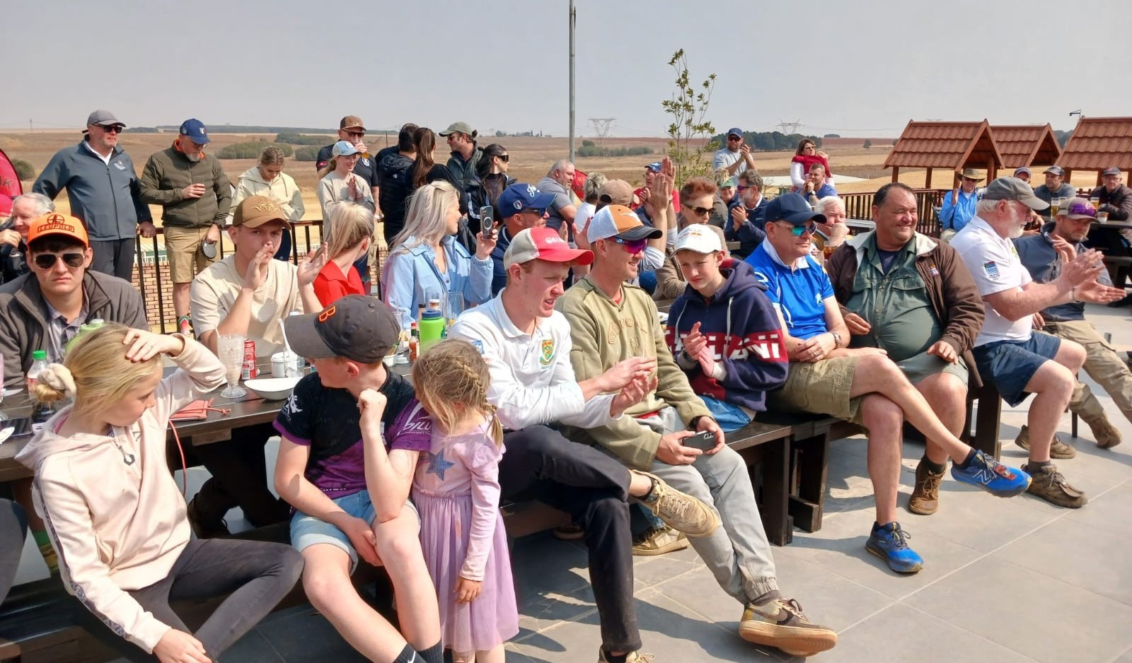 Spectators applauding at a Compak SA prize giving