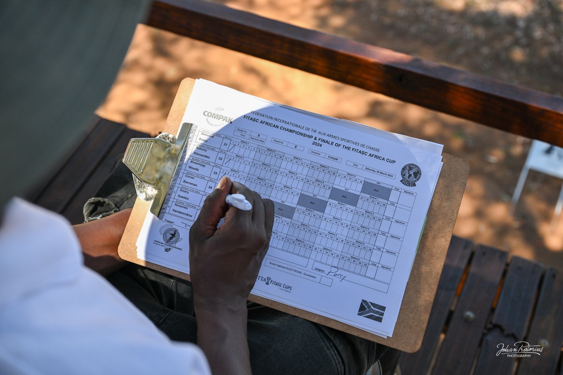 Compak Sporting shooters, scorecards and shotguns at a FITASC championship