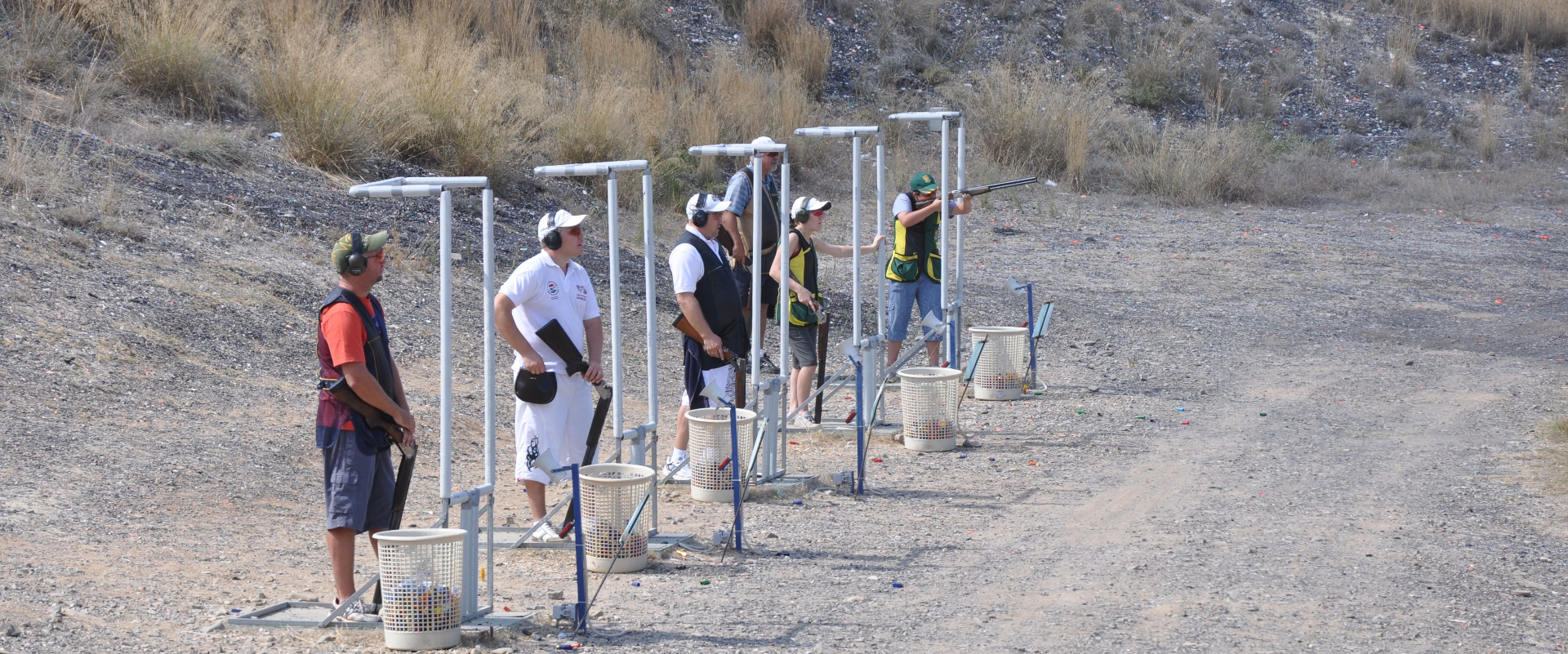 Shooters on the Compak stands at the 2012 World Championships