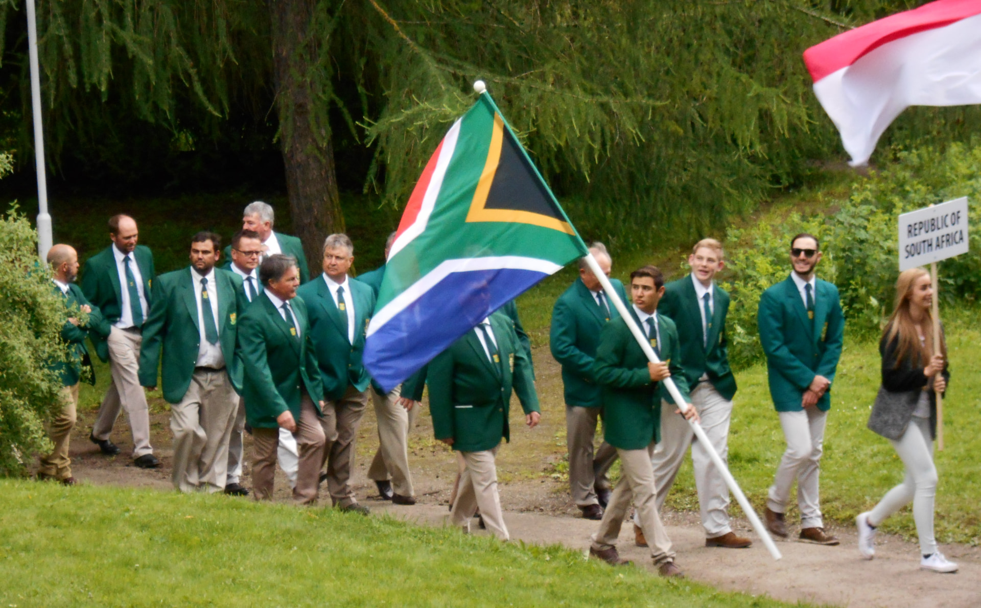 Team South Africa marching behind the flag at a FITASC opening ceremony